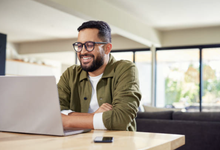 Advisor on a video intake call at a sunlit desk